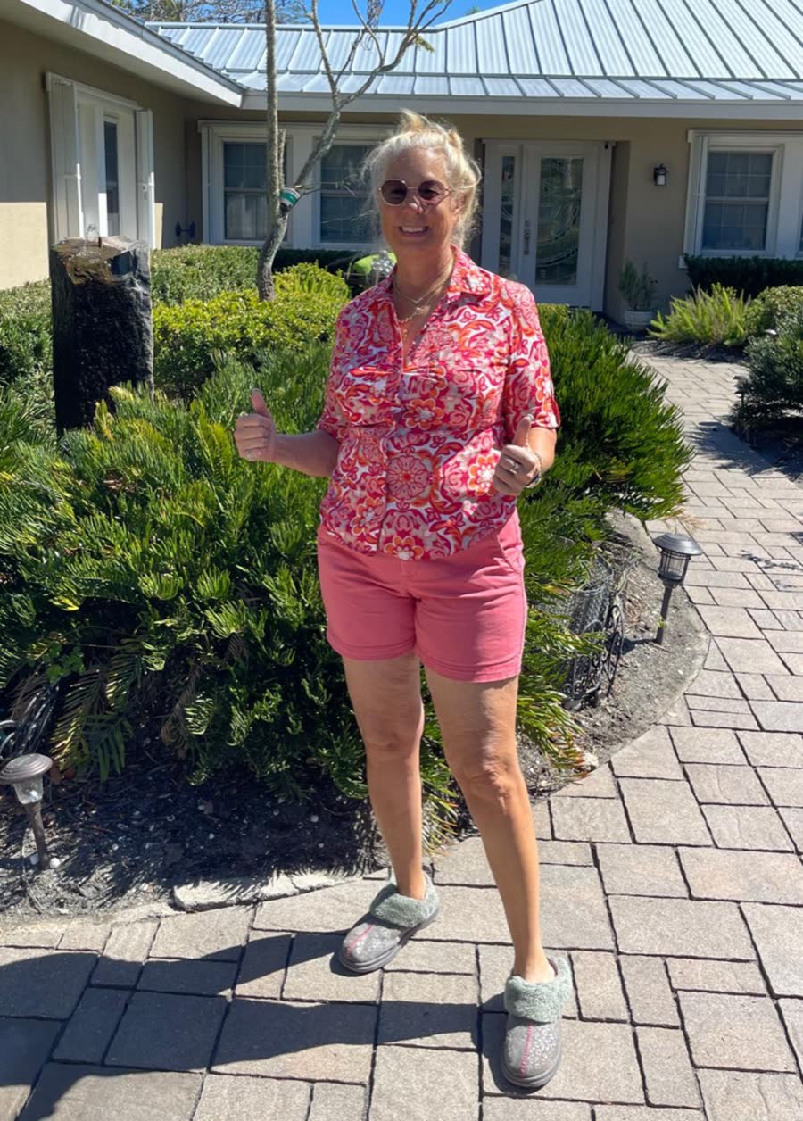 KB Sealing customer smiling on her sealed paver walkway